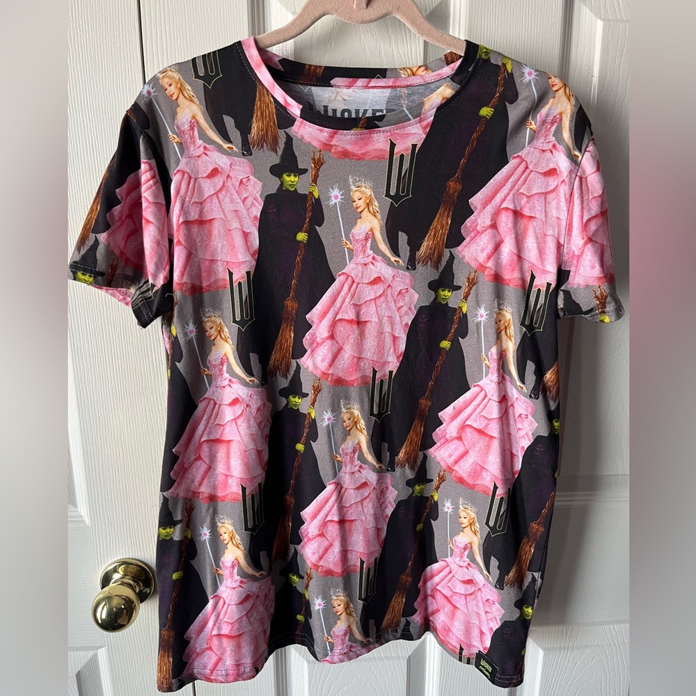 Wicked Movie x Cakeworthy All-Over Print T-Shirt | Unisex Medium | Pink & Black